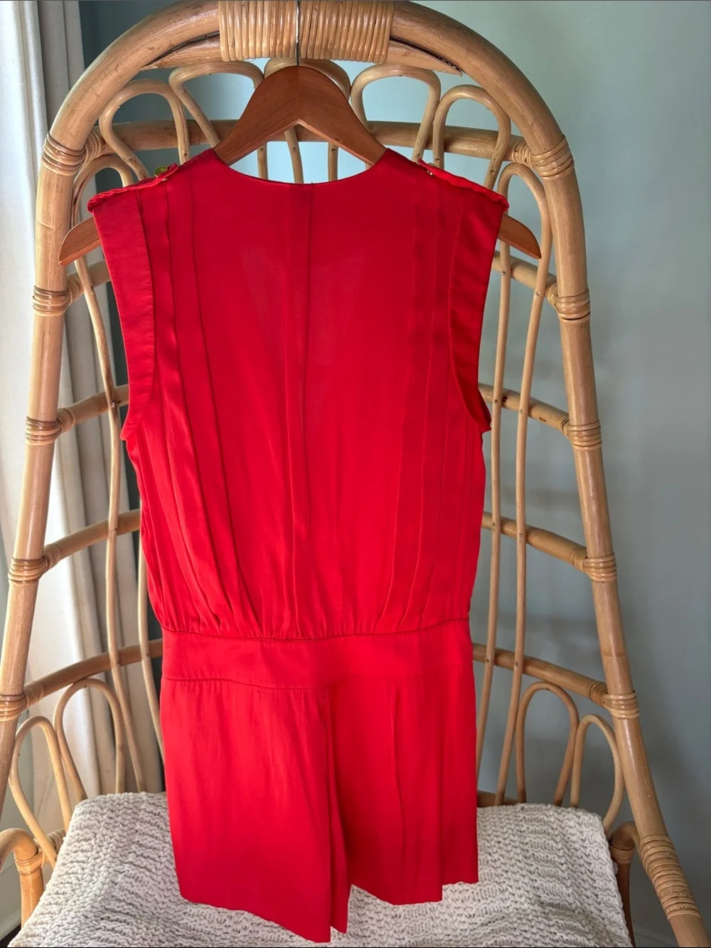 Beautiful Bebe satin vibrant red/orange romper with gold accents.